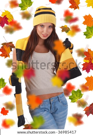 Beautiful girl wearing hat and gloves and maple leaves