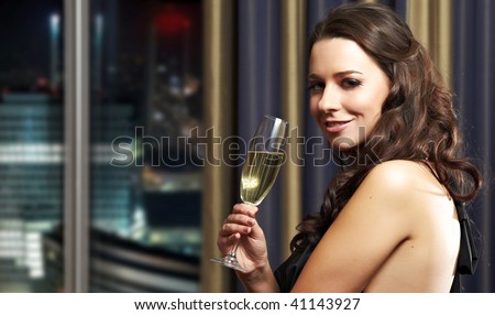 Beautiful lady with a champagne, night life style