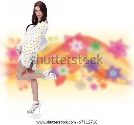 Spring woman dressed flower coat posing on flower  background