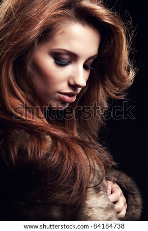 beautiful woman in a fur coat