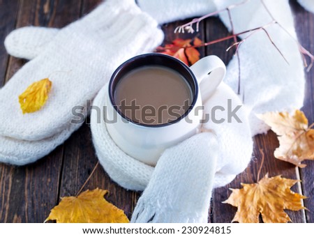 cocoa drink in cup and on the table