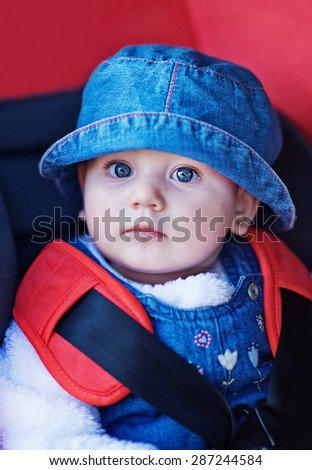 baby in a safety car seat. Safety and security