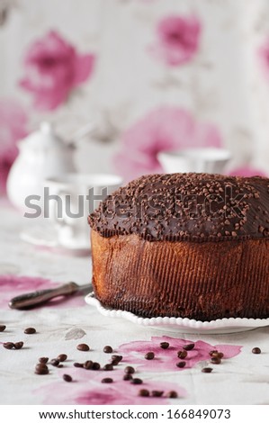 Traditional Italian panettone with coffee and chocolate, selective focus