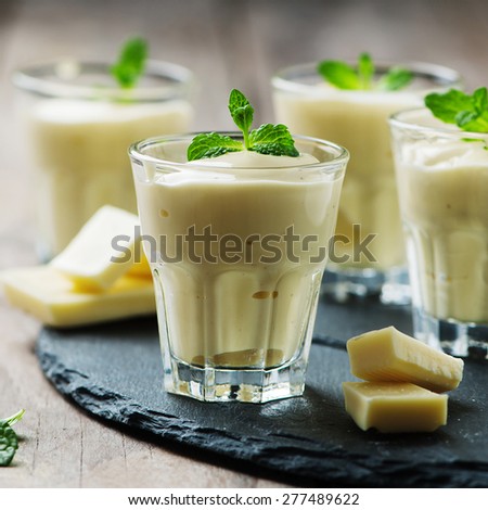 Mousse with white chocolate and mint, selective focus and square image