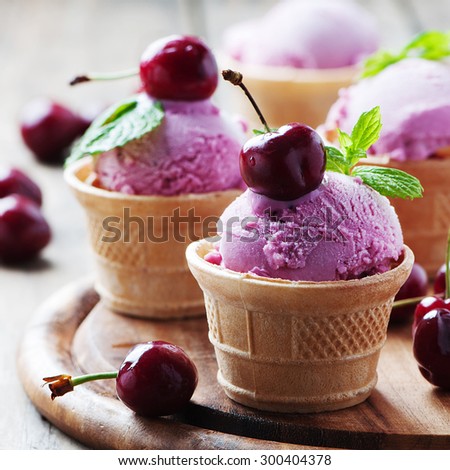 Cherry ice-cream with mint, selective focus and square image