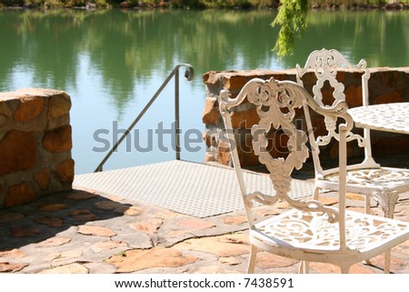 Wrought Iron chair on the Patio on an olive farm in the Western Cape