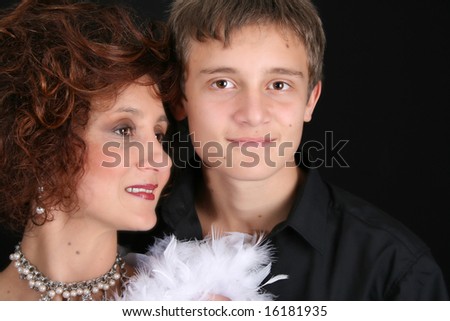 Rich and stylish mother and son in formal attire