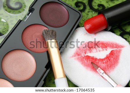 New eyeshadow set with used lipstick and lip print
