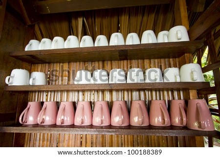 coffee mug shelf, pink and white coffee mug glass on shelf
