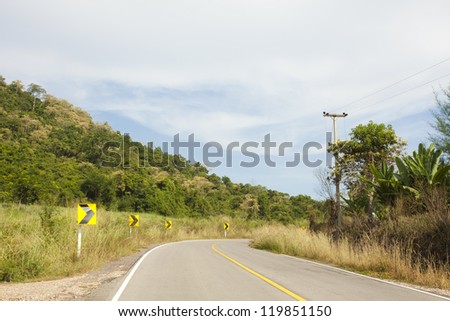 mountain street, yellow line on highway street curve along mountain