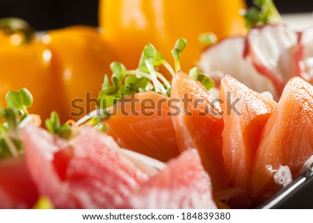 sashimi, raw fish mixed in traditional Japanese style eat with slice daikon radish