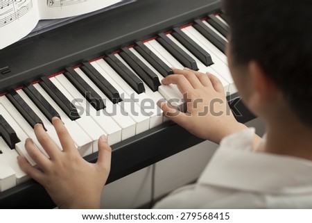 piano lesson, Asian boy kid activity playing piano with notes