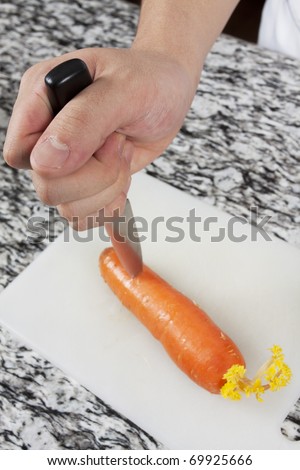 Stabbing carrot, Someone stabbing carrot with a knife.