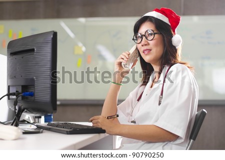 Doctor Santa phone, Female Santa wearing doctor costume with Santa red hat on the phone.