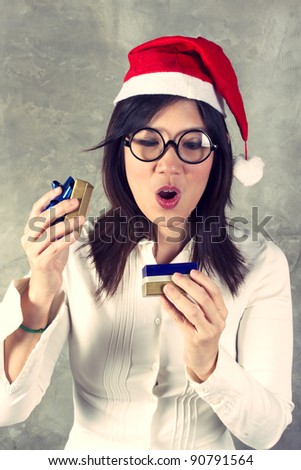 Gift for Santa, female Santa opening gift box with surprise action.