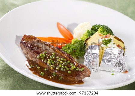 beef sirloin steak, sirloin steak with brown pepper sauce and baked potato
