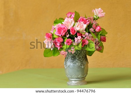 Vase of flowers in wood room