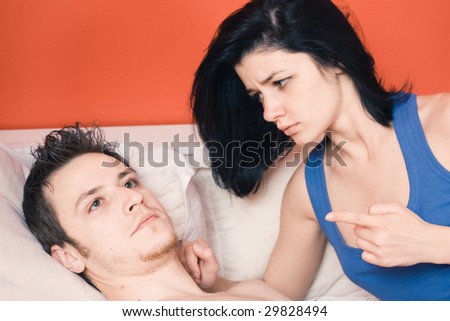Couple arguing in bed, woman is right