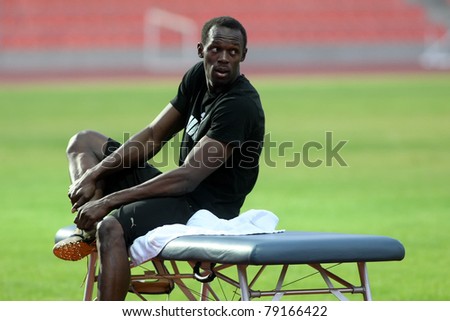 THESSALONIKI,GREECE -SEPTEMBER 11:Jamaican U. Bolt stretching in the training center for the IAAF World Athletics Finals main event in Kaftatzoglio Stadium on September 11, 2009 in Thessaloniki,Greece