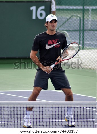 INDIAN WELLS, CA - MARCH 17.  Switzerland\'s Roger Federer  practices his volley March 17, 2011 at the BNP Paribas Open.