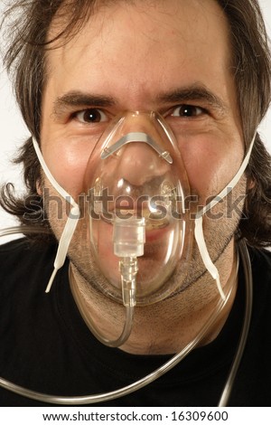 A Male Breathing Through An Oxygen Mask With Odd Expression On His Face ...