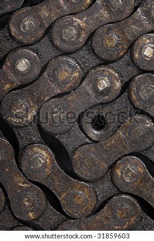 Macro image of a dirty oily bicycle chain as a background.
