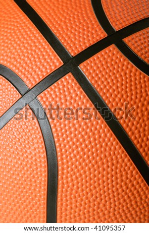 A macro background image of the texture of a basketball. Focus is in the middle.