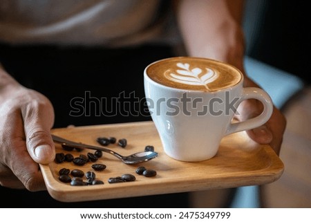 Similar – Foto Bild Nahaufnahme einer Tasse Kaffee mit Milch von oben gesehen