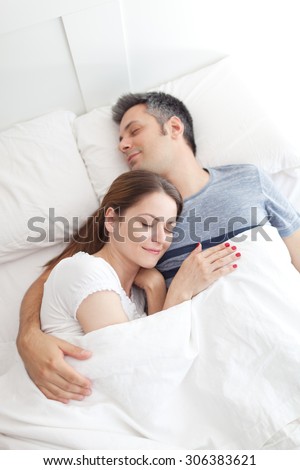 Image of young couple asleep