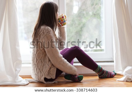 Similar – Image, Stock Photo Pensive woman sitting on bed