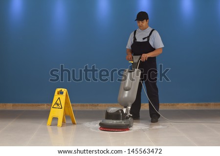 cleaning floor with machine