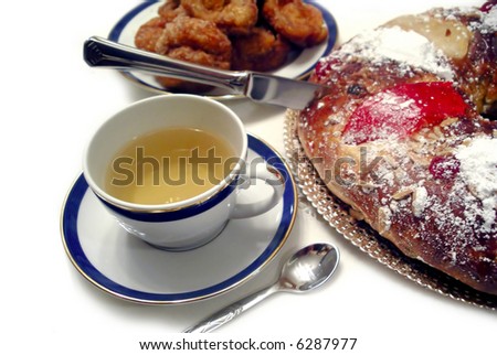 Photo of table-set with tea and traditional christmas desserts