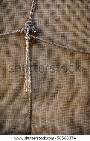 background of sackcloth wrap tied up with ropes