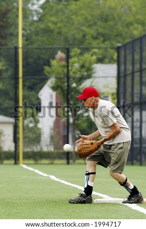 Senior first baseman catching ball.