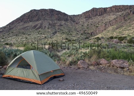 Camp site at base of mountains in desert
