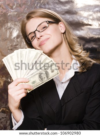 portrait of pretty young woman with money