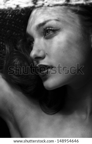 woman dressing sweater, black and white close up