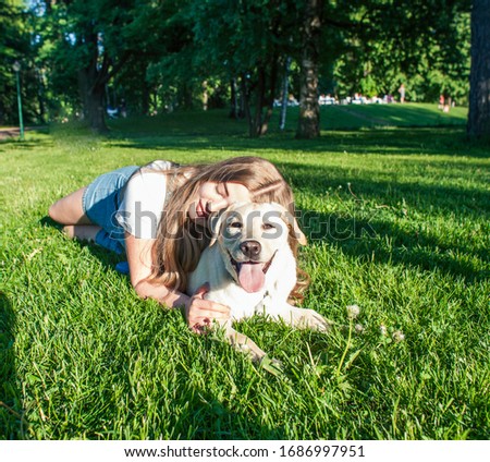Similar – Image, Stock Photo Little girl laying playing on grass enjoying summer day during vacation trip