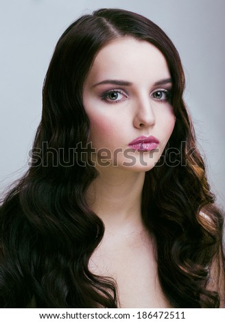 pretty young brunette woman with hair style like cute doll