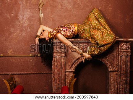 portrait of beauty sensual young woman in oriental style in luxury room