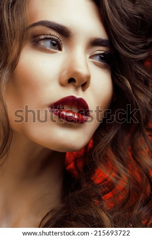 Beauty Woman with Perfect Makeup Beautiful Professional Holiday Make-up. Red Lips and Nails Beauty Girls Face isolated on Black background Glamorous Woman