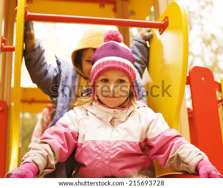 little cute boy and girl playing outside, brother and sister