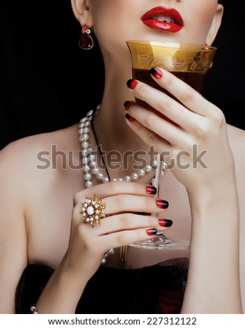 beauty stylish redhead woman with hairstyle and manicure wearing jewelry