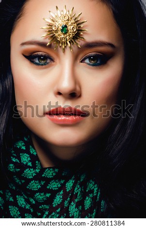 beauty eastern woman with jewelry close up, bride star brooch bright colored
