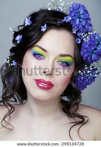 Beauty young woman with flowers and make up closeup, real spring beauty girl floral summer