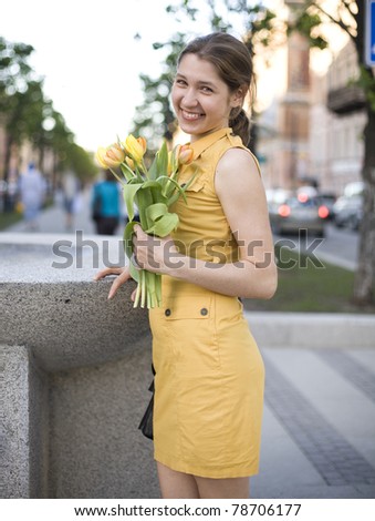 stock-photo-happy-woman-holding-flowers meeting friend