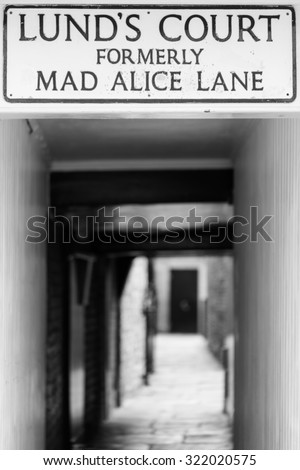 YORK, UK - DECEMBER 29TH 2013: Street sign for Lund\'s Court Formerly Mad Alice Lane in York, on 29th December 2013.