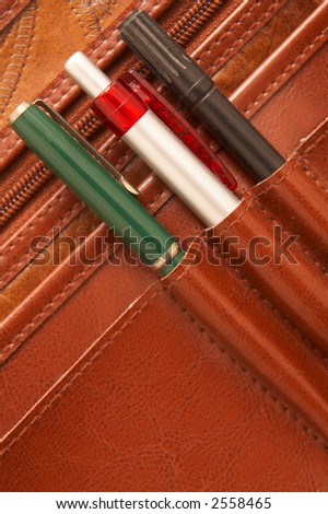 Pencils in a brown attache case