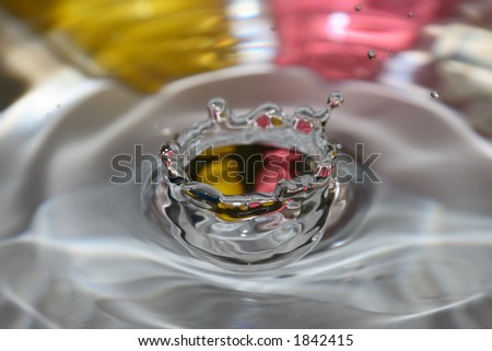 Drip crown frozen in time with pink and yellow background