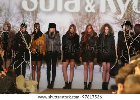 TORONTO - MARCH 13: Models stand at the end of the runway in the Soia & Kyo runway show for the Fall/Winter 2012 season at Toronto\'s World Mastercard Fashion Week on March 13, 2012 in Toronto, Canada.